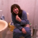 A French girl is video-recorded singing while taking a shit on the toilet. No audible poop sounds.